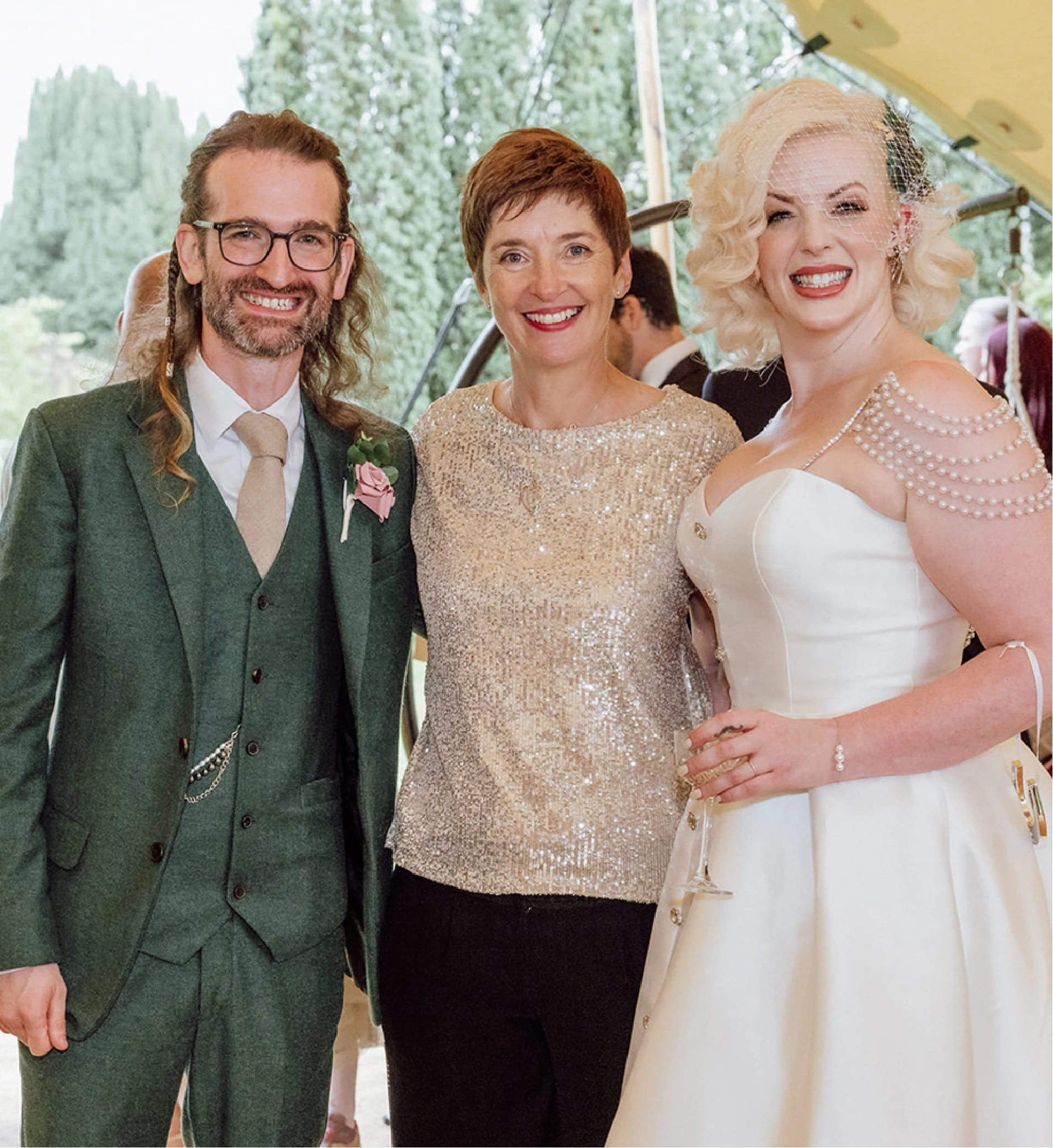 Rosemary Hartigan with a newly married bride and groom