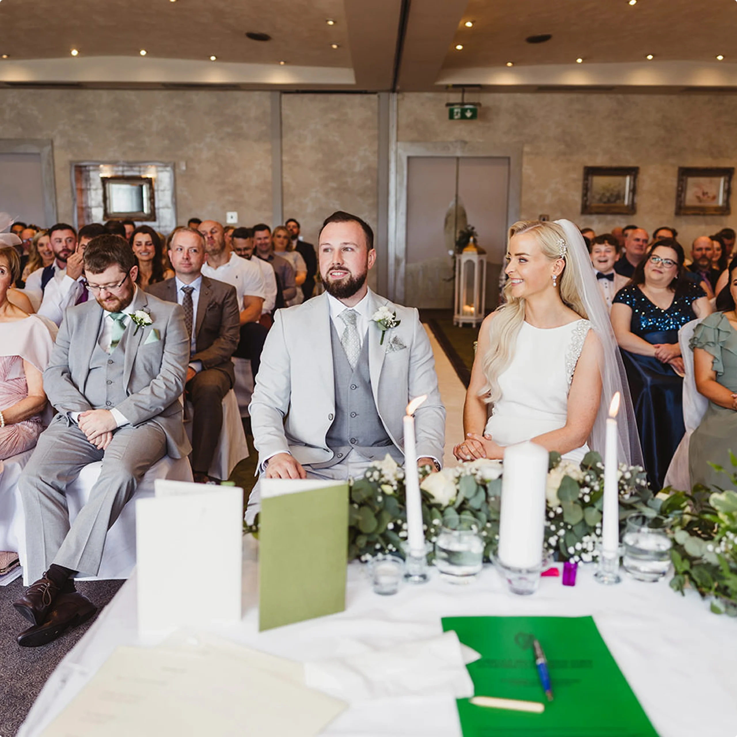 Bride and groom at the signing table after their ceremony at Ferrycarrig, Wexford