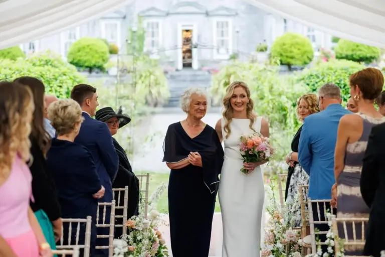 Anna walking in with her mother at the start of her ceremony at Castle Durrow