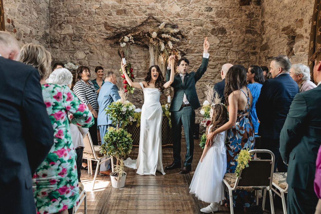 Aoife and Conor celebrating with their guests at the end of their ceremony at Murphy’s Barn, Wexford