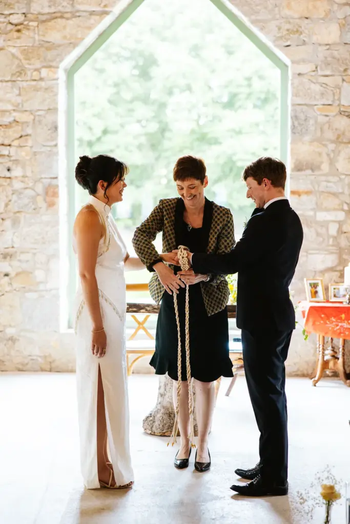 A handfasting ritual during a ceremony at Ballykealey House