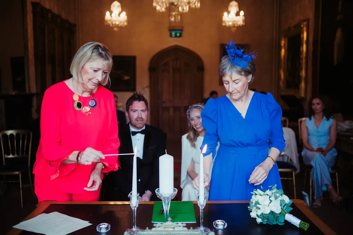 A couple lighting a unity candle at Johnstown Castle, Wexford